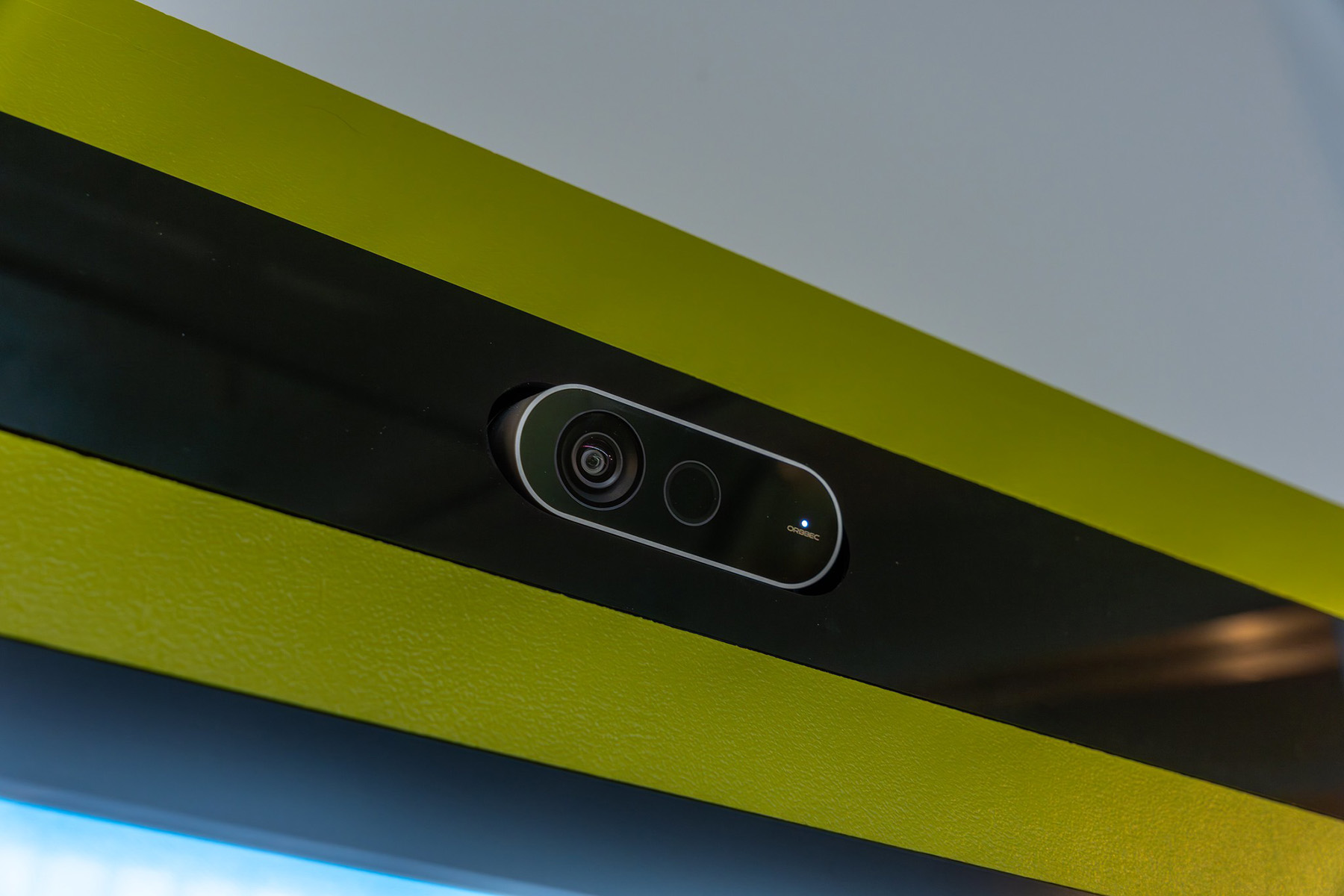 Integrated Orbecc Femto Bolt Cameras are integrated into the top of each cabinet, allowing visitors to add their photos to their postcards.