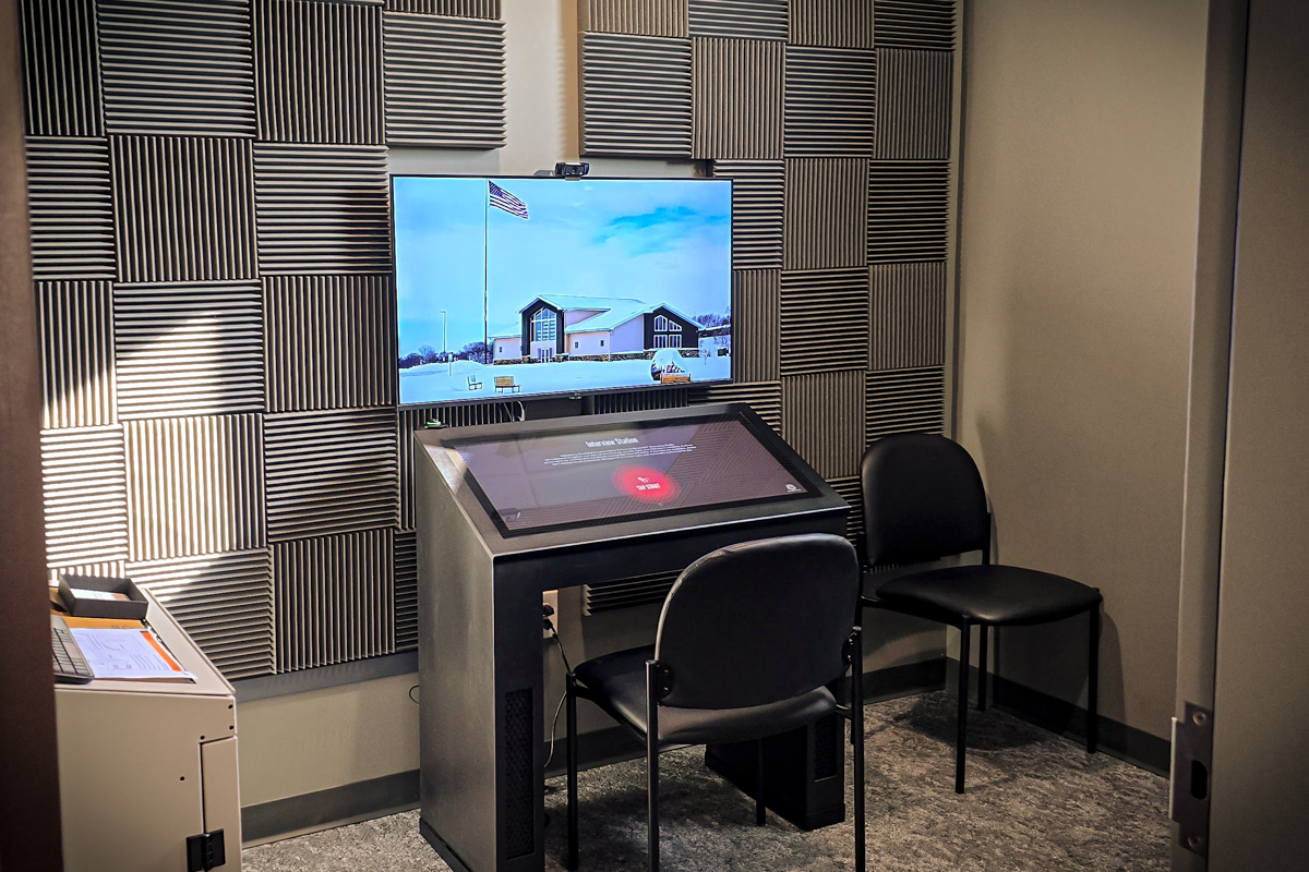 The station is in a private room with sound dampening panels, providing each veteran privacy and comfort during their interview.