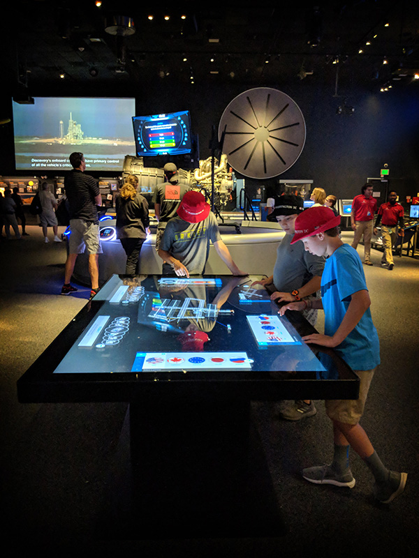 At Design It!, an exhibit at the Smithsonian Air and Space Museum, visitors play side by side to create their own space station modules.