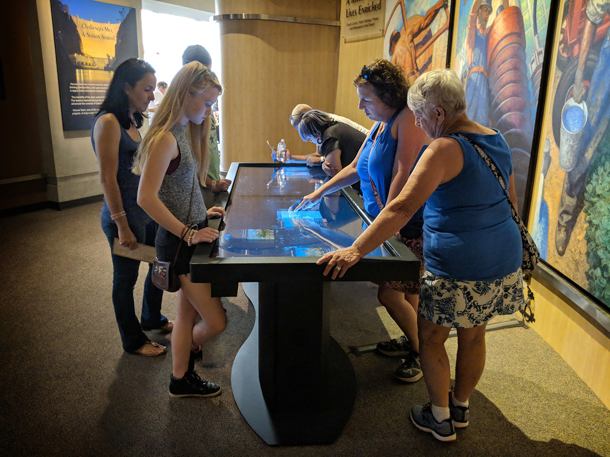 Ideum’s large-format Pano table at Hoover Dam Museum allows traveling companions to explore the technologies of the dam together.
