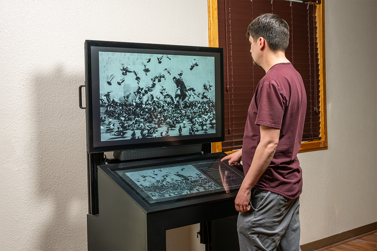 The TouchStory application supports interactive video, audio, and image media, which can be displayed on a secondary screen or projector such as this custom dual screen kiosk. 