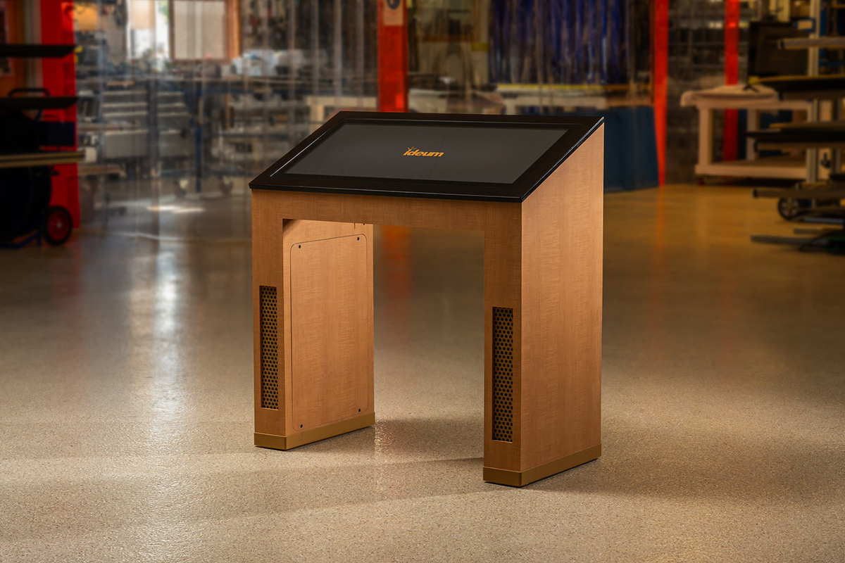 Made of a wood grain patterned laminate, this custom Reader Rail kiosk was the first to use the new material.