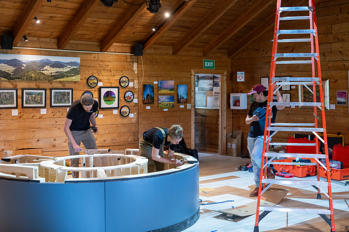 Behind-the-scenes as Ideum’s fabrication team installs the pedestal, housing many of the electronic components for the projection-mapped interactive at Valles Caldera.
