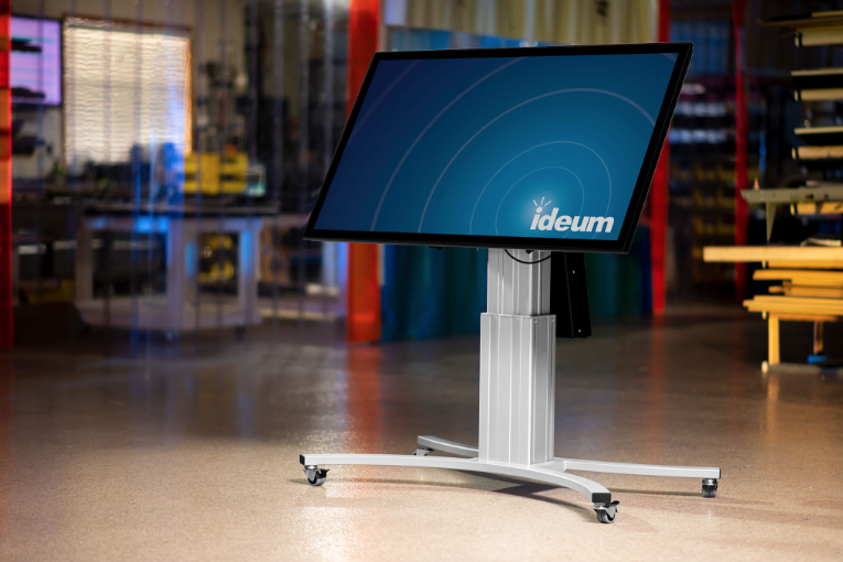 Presenter on a BigLift motorized display stand.