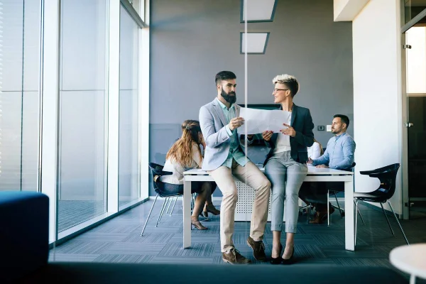 Business consultants reviewing project plans in an office