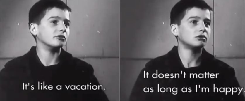 two panelsin black and white a young boy looks off-screen right in front a a plain wall. The captions read "It's like a vacation. It doesn't matter as long as I'm happy"