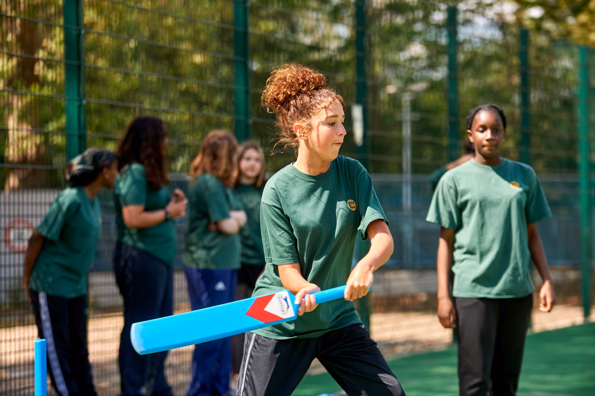 A student playing cricket at The Charter School East Dulwich
