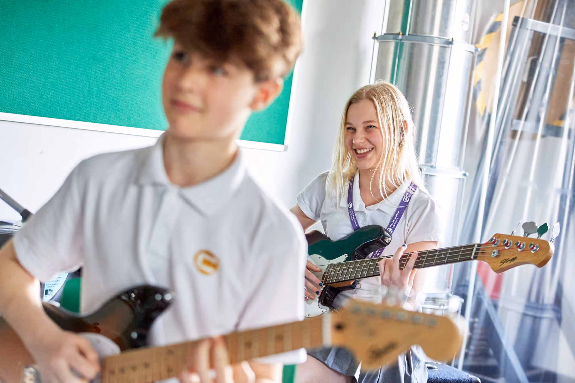 Two students playing guitar and bass at Charter School East Dulwich