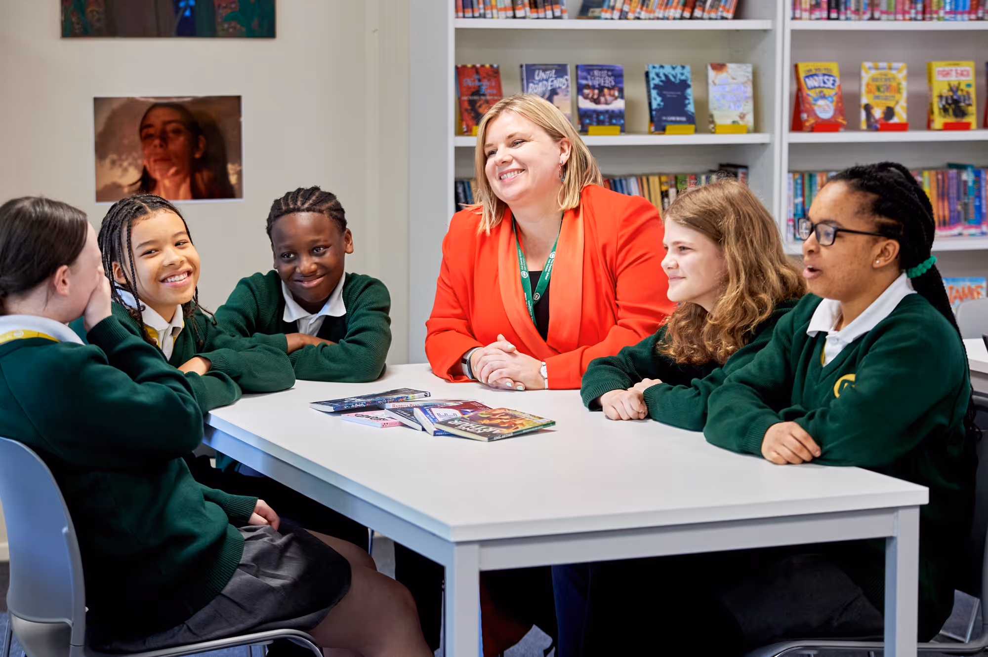 Alison Harbottle, headteacher at the Charter School East Dulwich sits with a group of students
