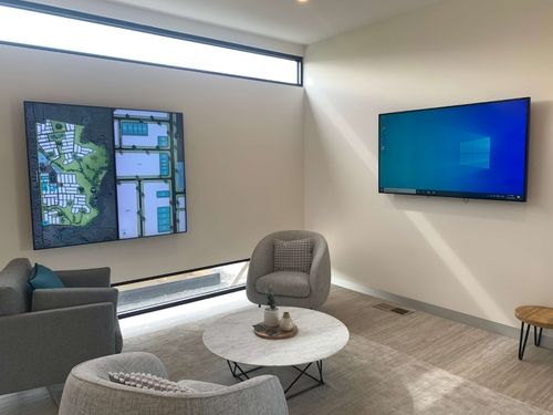 Kingsfield Land Sales Office depicting digital signage amongst furniture and furnishings