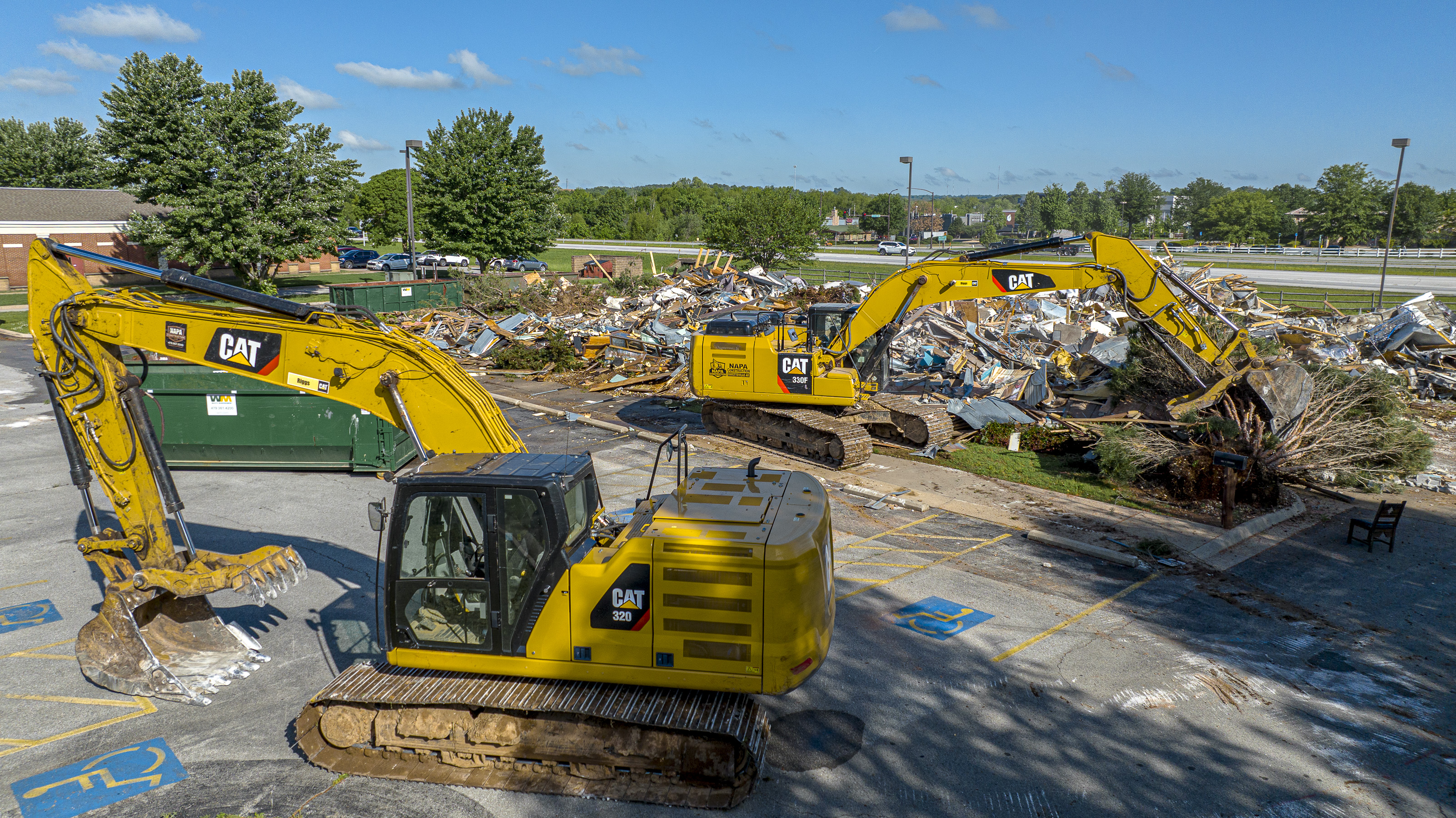 Excavators working on a commercial demolition site