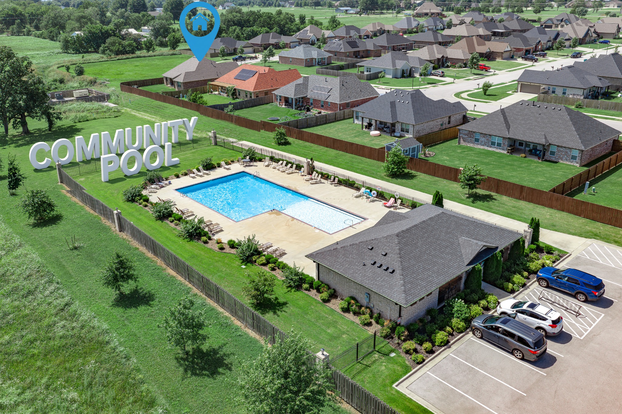 Aerial view of a community pool and clubhouse