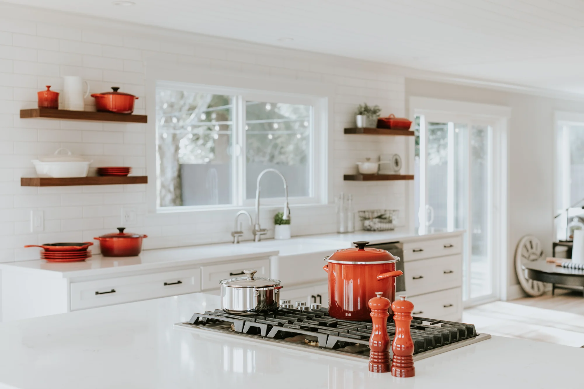 Interiors · White kitchen with red accents
