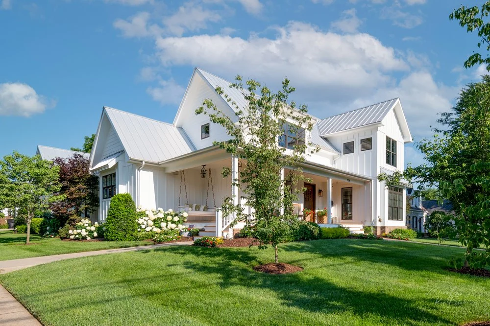 Exteriors · Farmhouse and lawn