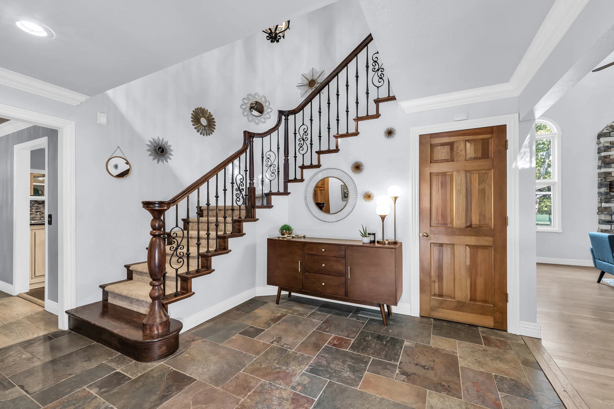 Interiors · Entryway and curved staircase