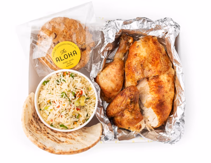 Box with chicken, pita bread, rice, and cookie