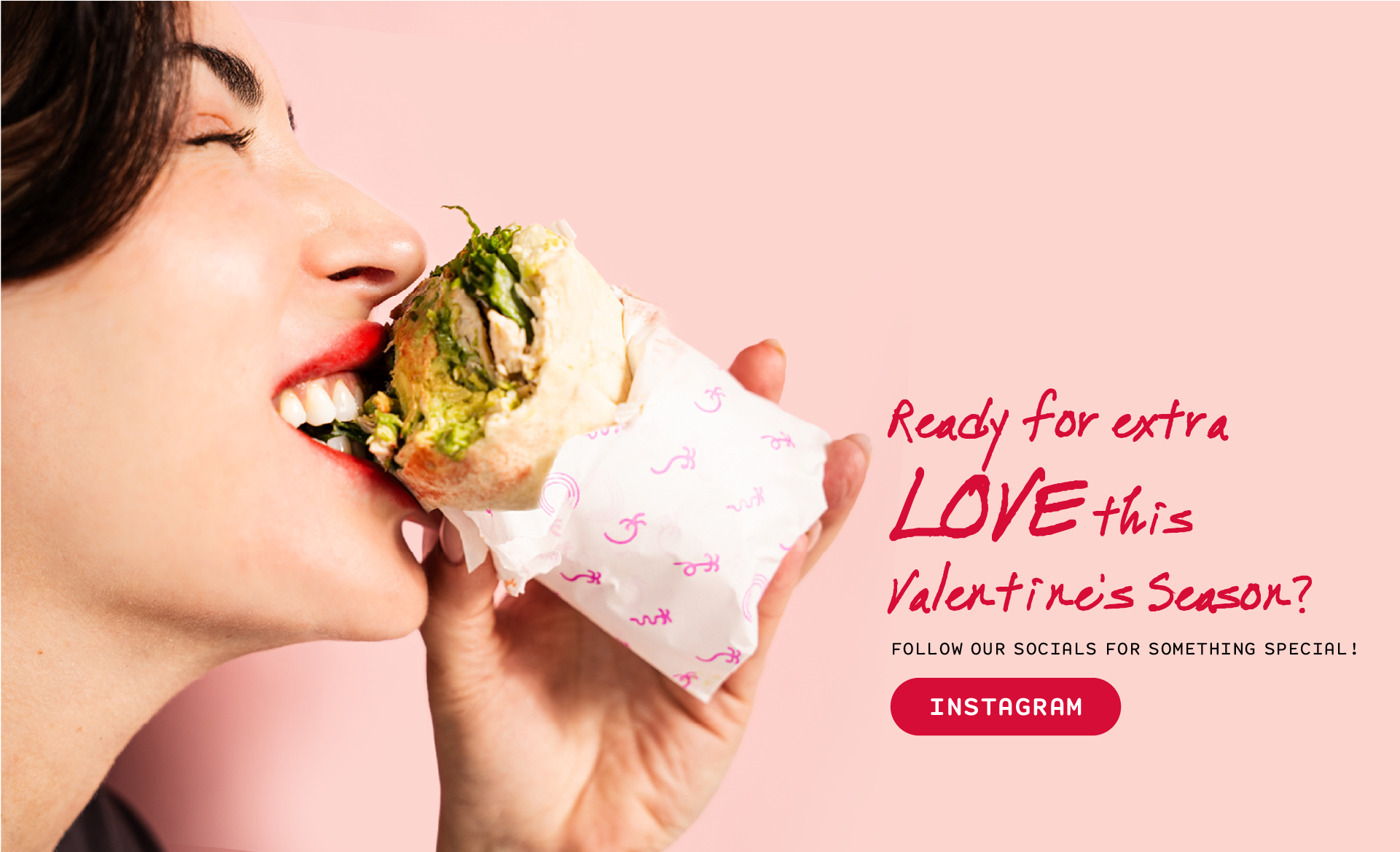 Two hands holding two types of wraps, on the left is LA Wrap and on the right is Green Goddess wrap