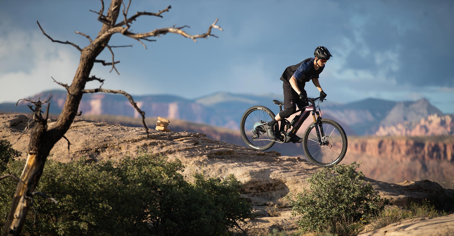A biker riding a trail.