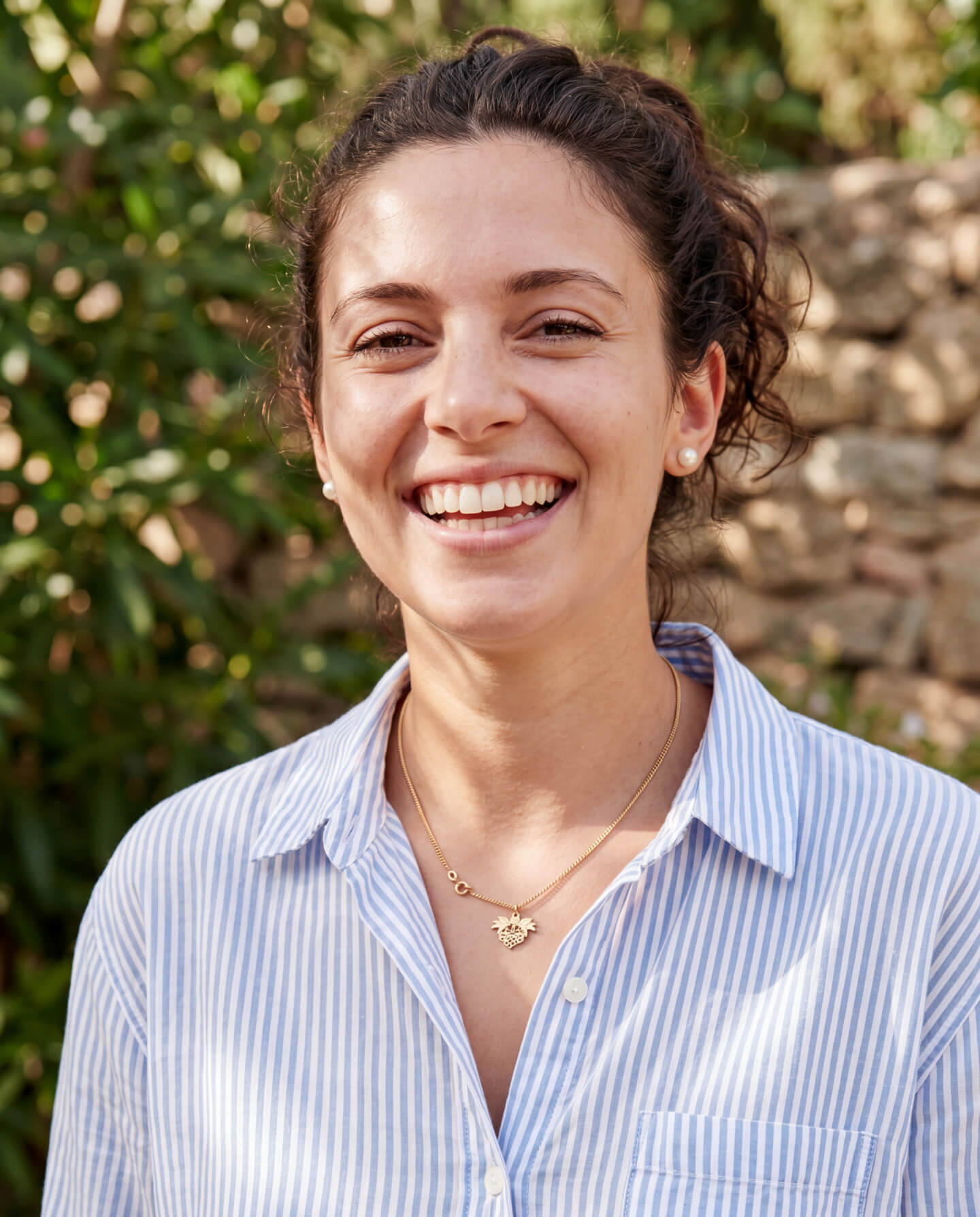 woman smiling with blue shirt