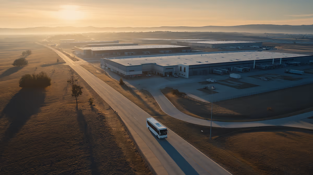 warehouse in the countrside at dawn with bus departing