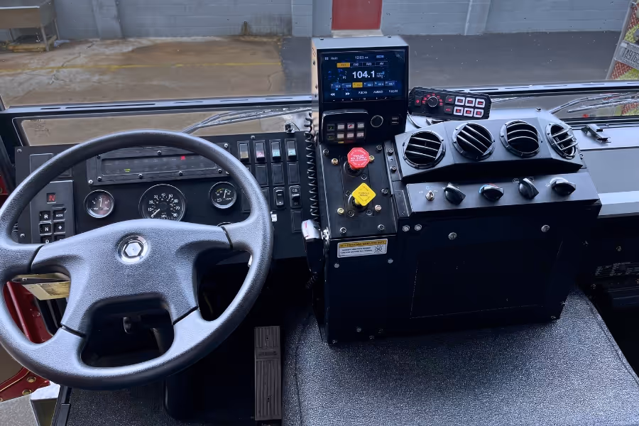 Interior view of the Acela Monterra cab, showcasing rugged controls, seating, and operator-focused design
