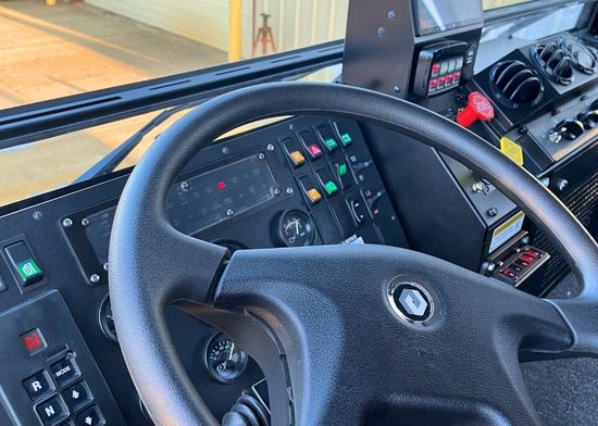 Acela Monterra cab interior showing driver controls, seating, and dashboard layout