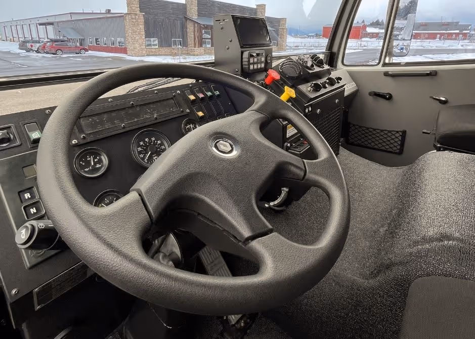 Acela Monterra cab interior showcasing driver controls, seating, and rugged design