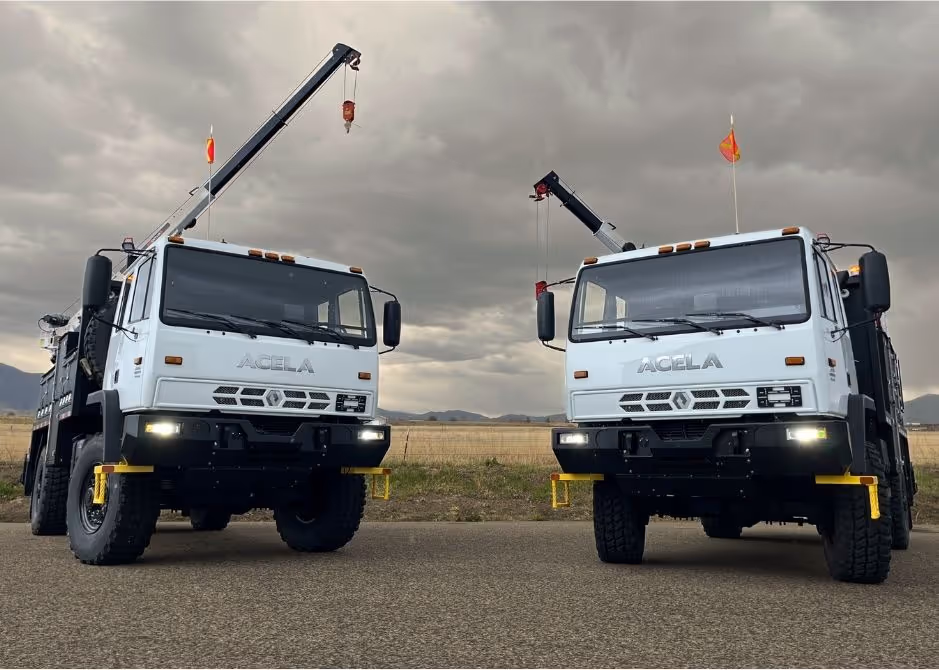 Two Acela Monterra 4x4 trucks with custom service bodies built in-house featuring cranes, service decks, and barn-style storage compartments