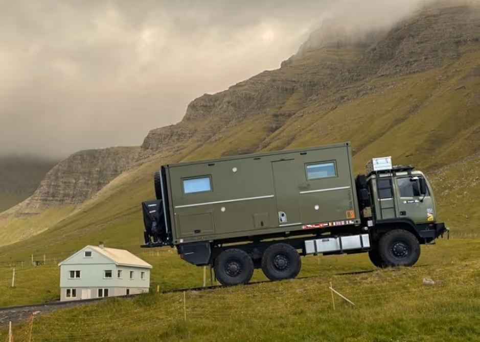 BAT, the Acela Monterra 6x6, driving up a hill in the Faroe Islands during an overland expedition