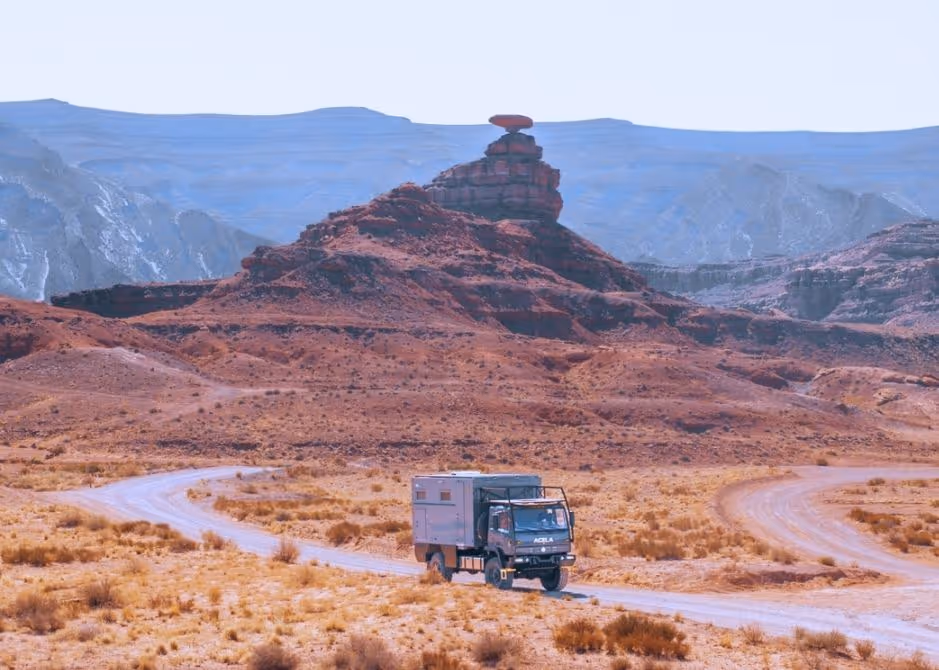 KRUG Expedition’s Acela Monterra 4x4 driving through desert terrain on an off-road adventure