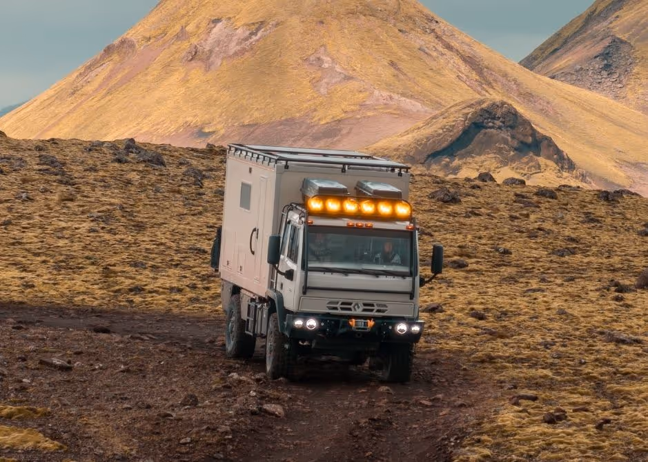 4xploration’s Acela Monterra 4x4 driving down a mountain road in Iceland during an overland expedition
