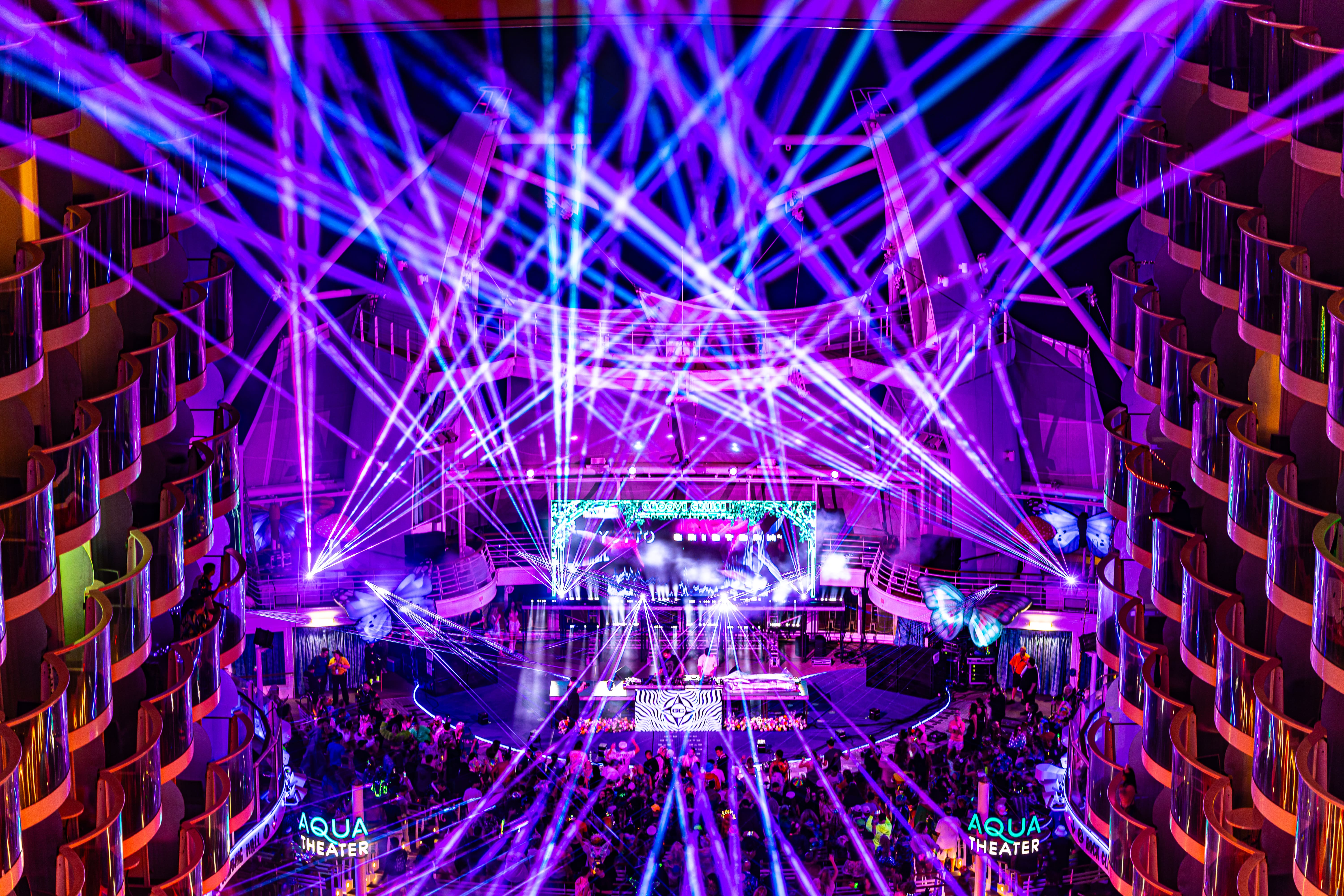 EDM cruise stage lit up with lasers and LED screens on Groove Cruise 2026