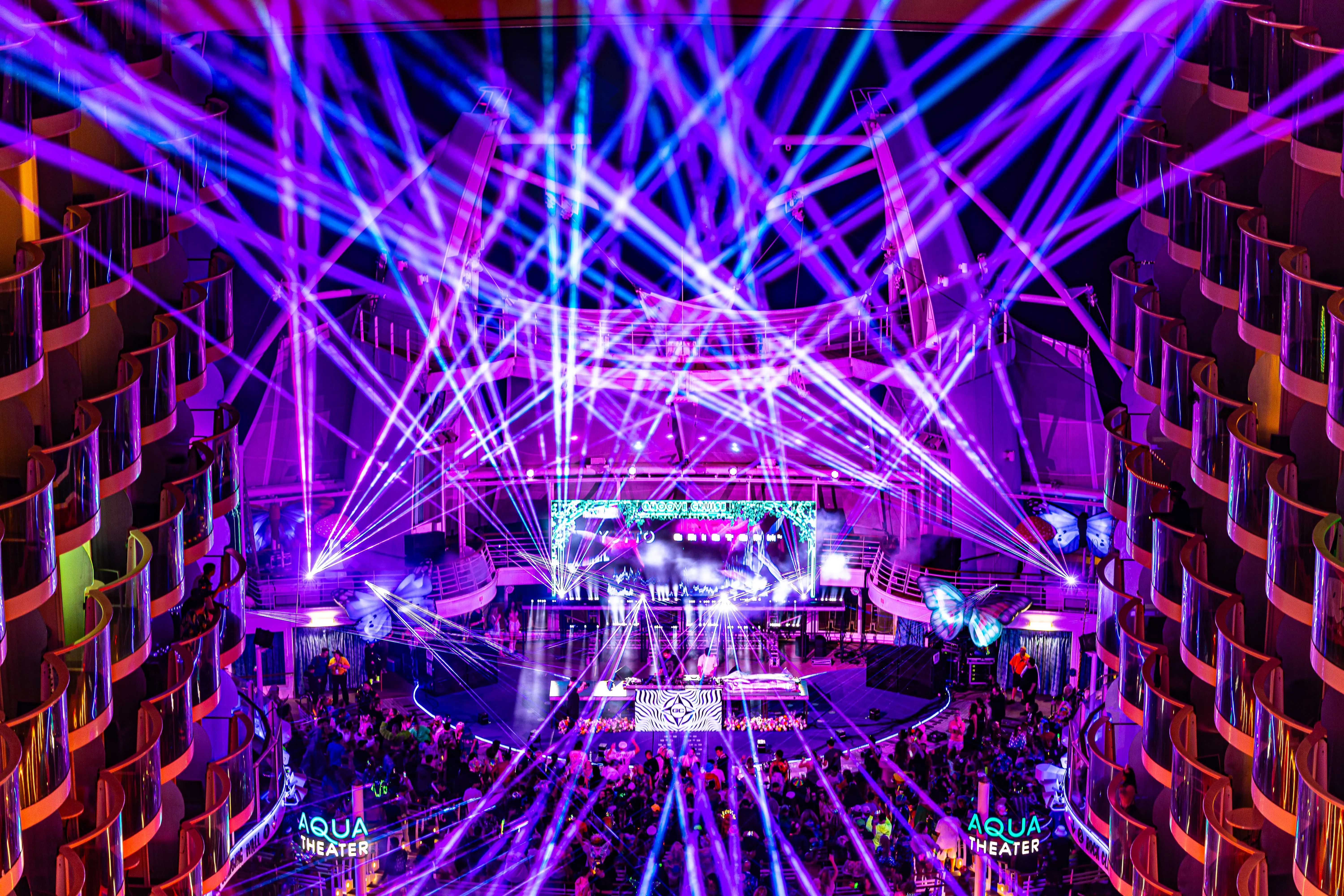 EDM cruise stage lit up with lasers and LED screens on Groove Cruise 2026