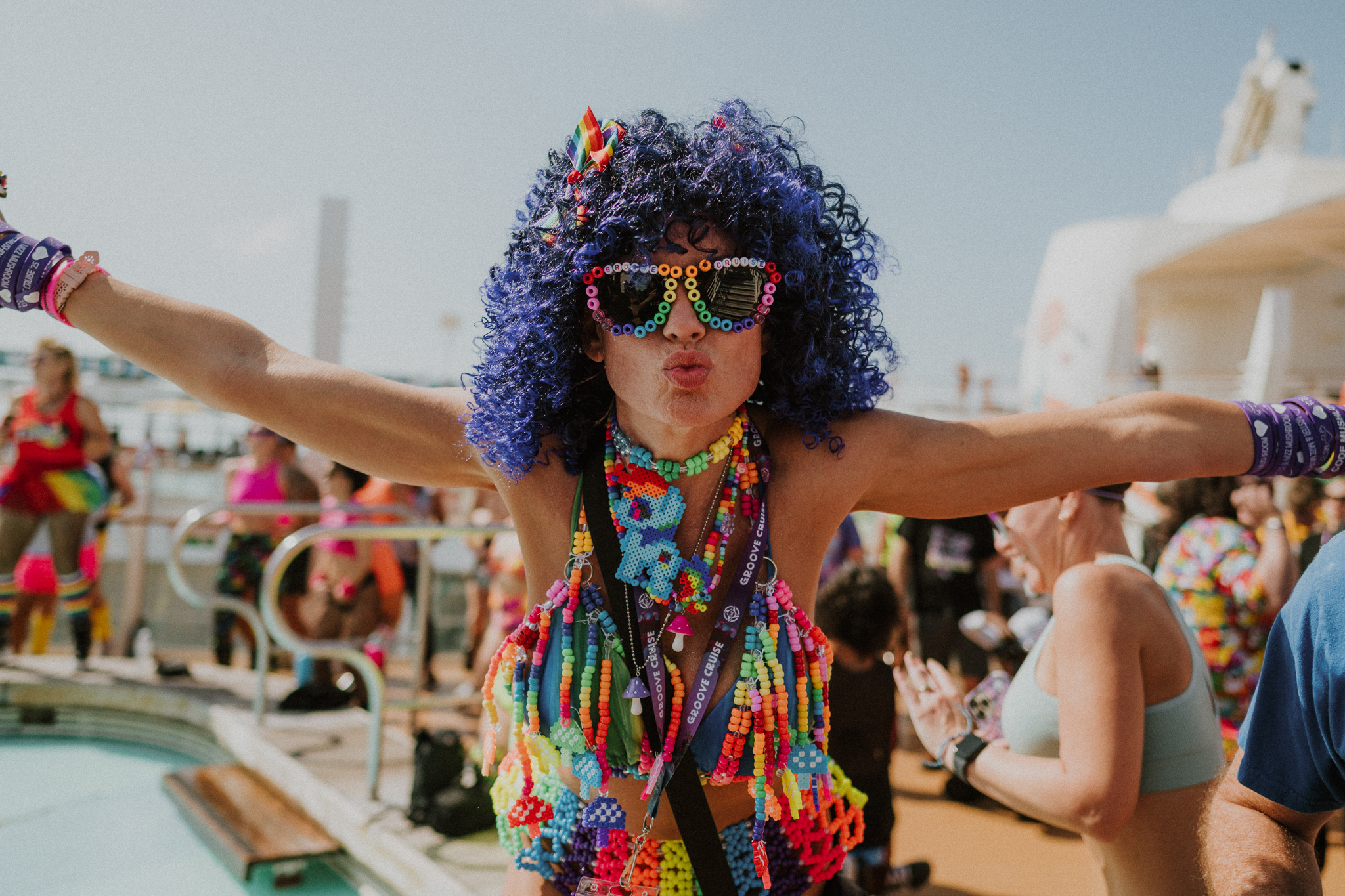 Solo traveler dressed up in colorful rave outfit on EDM cruise