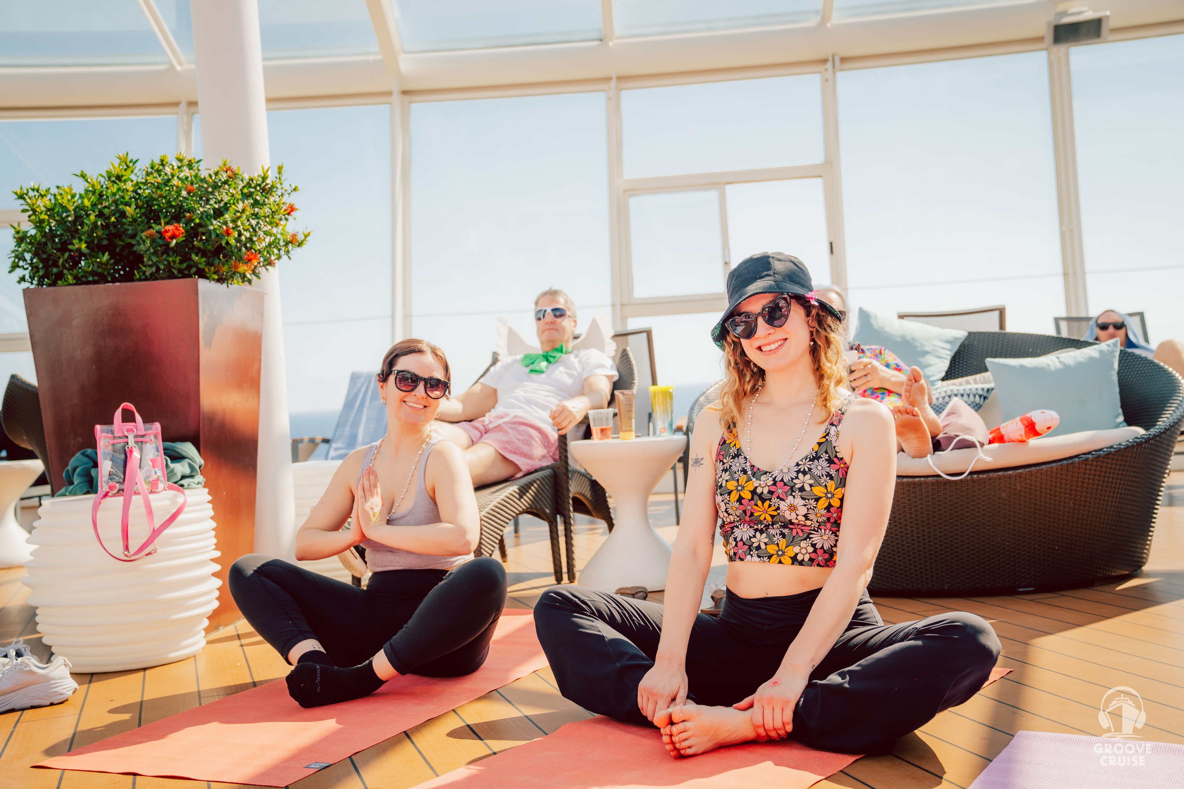 Festival attendees practicing yoga at sea