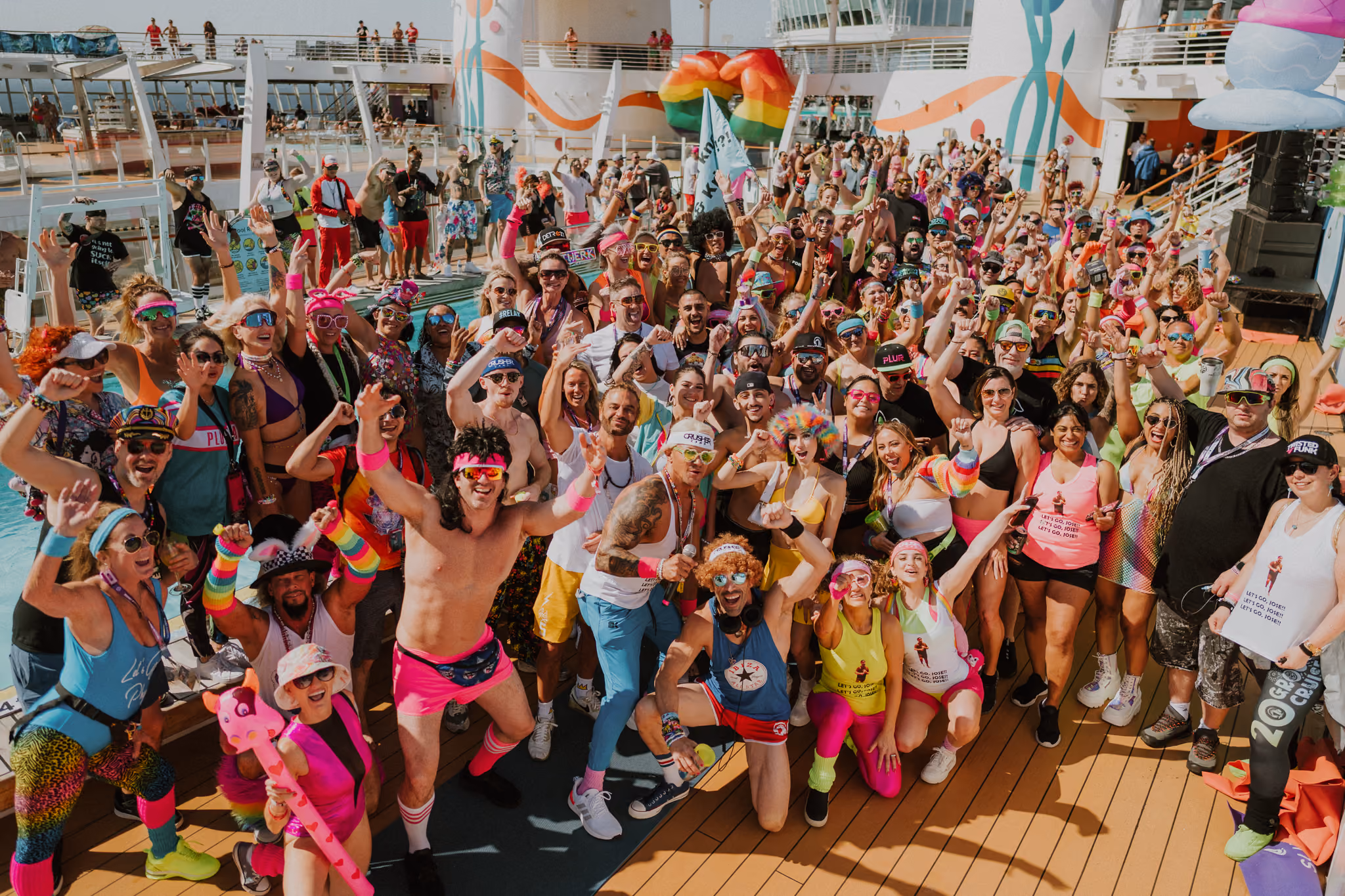 Groove Cruise 2025 guests dancing on the ship deck during EDM cruise festival