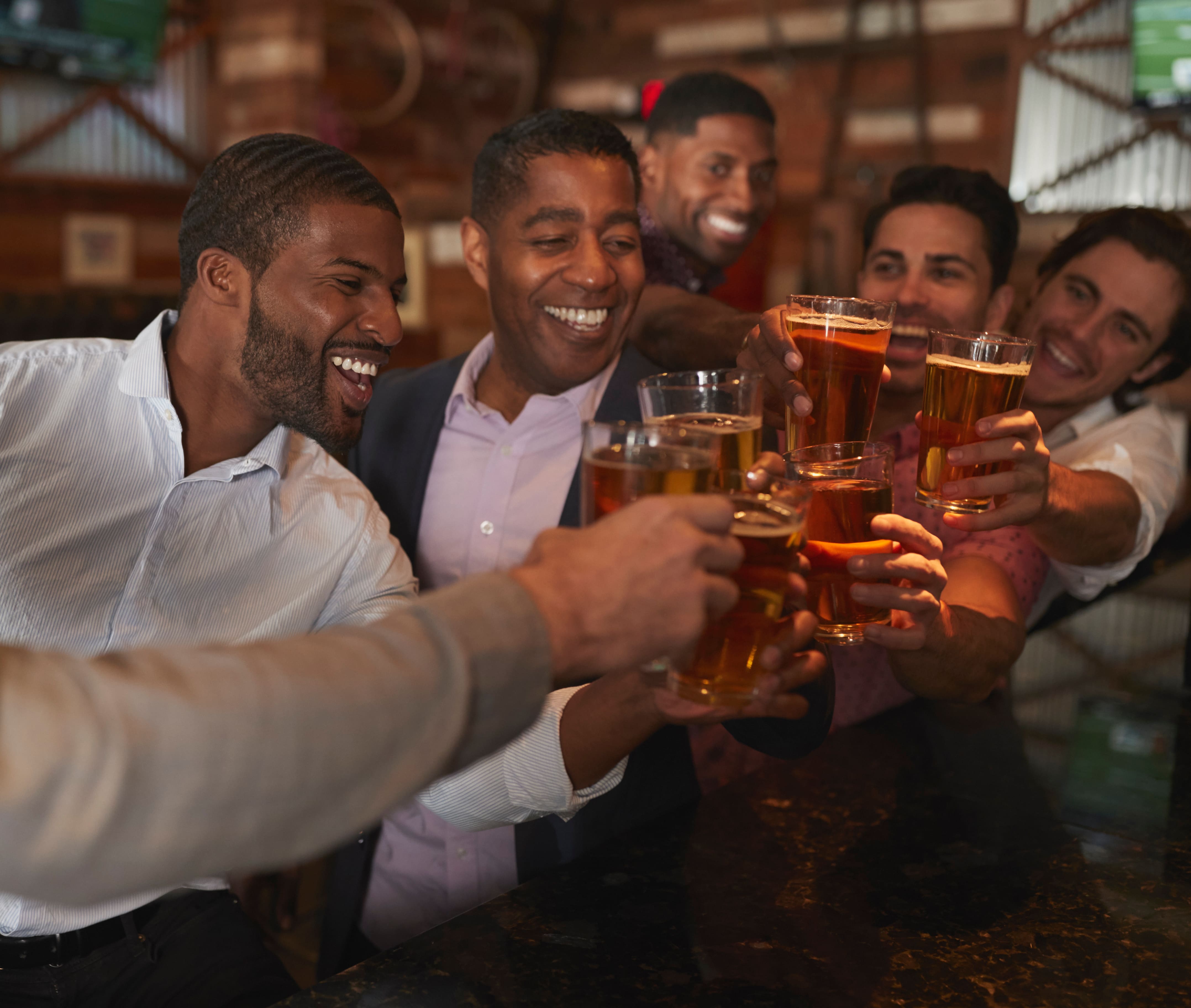 Group of friends with beers in a Miami during bachelor weekend