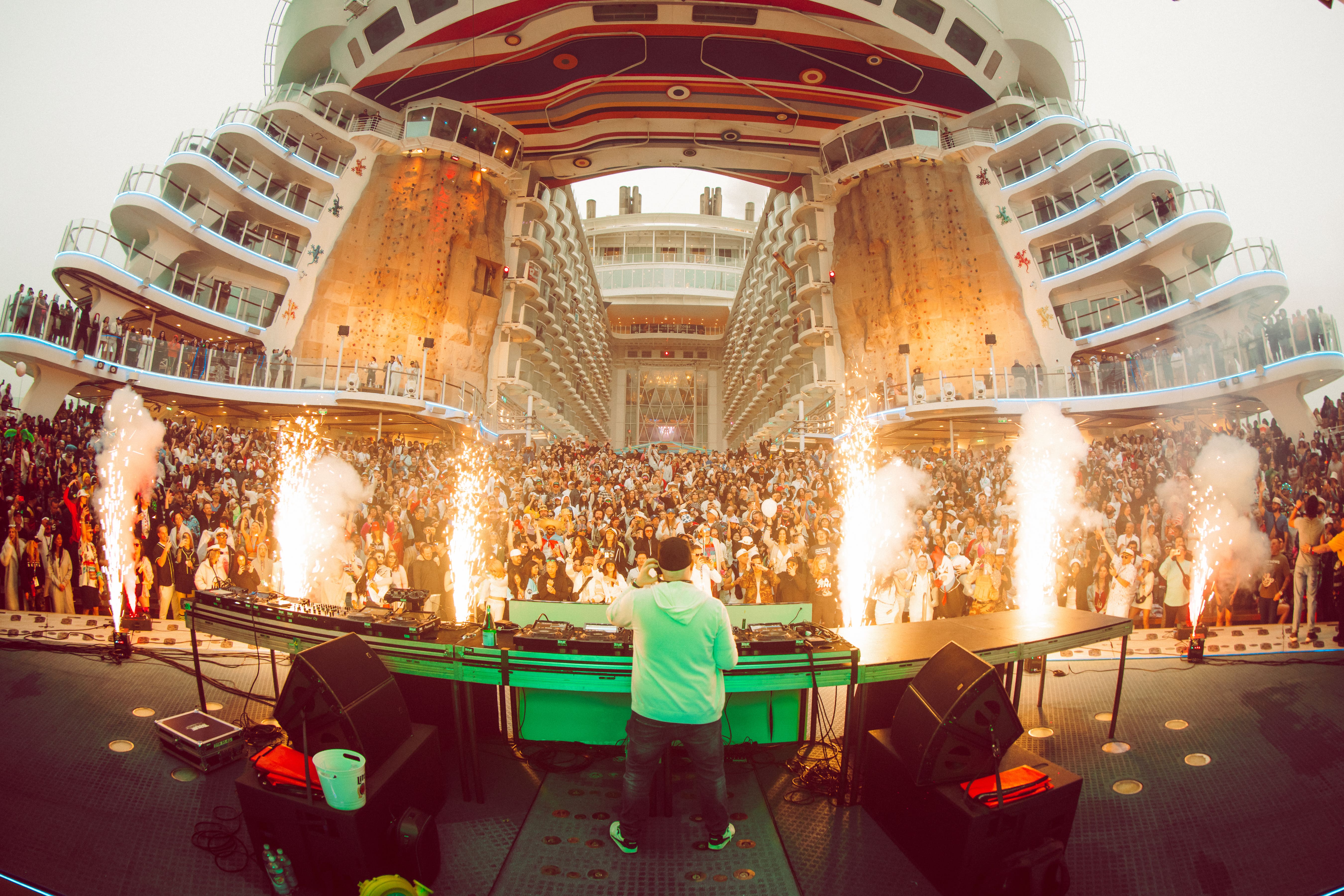Crowd dancing under lights on Groove Cruise 2026 EDM festival cruise
