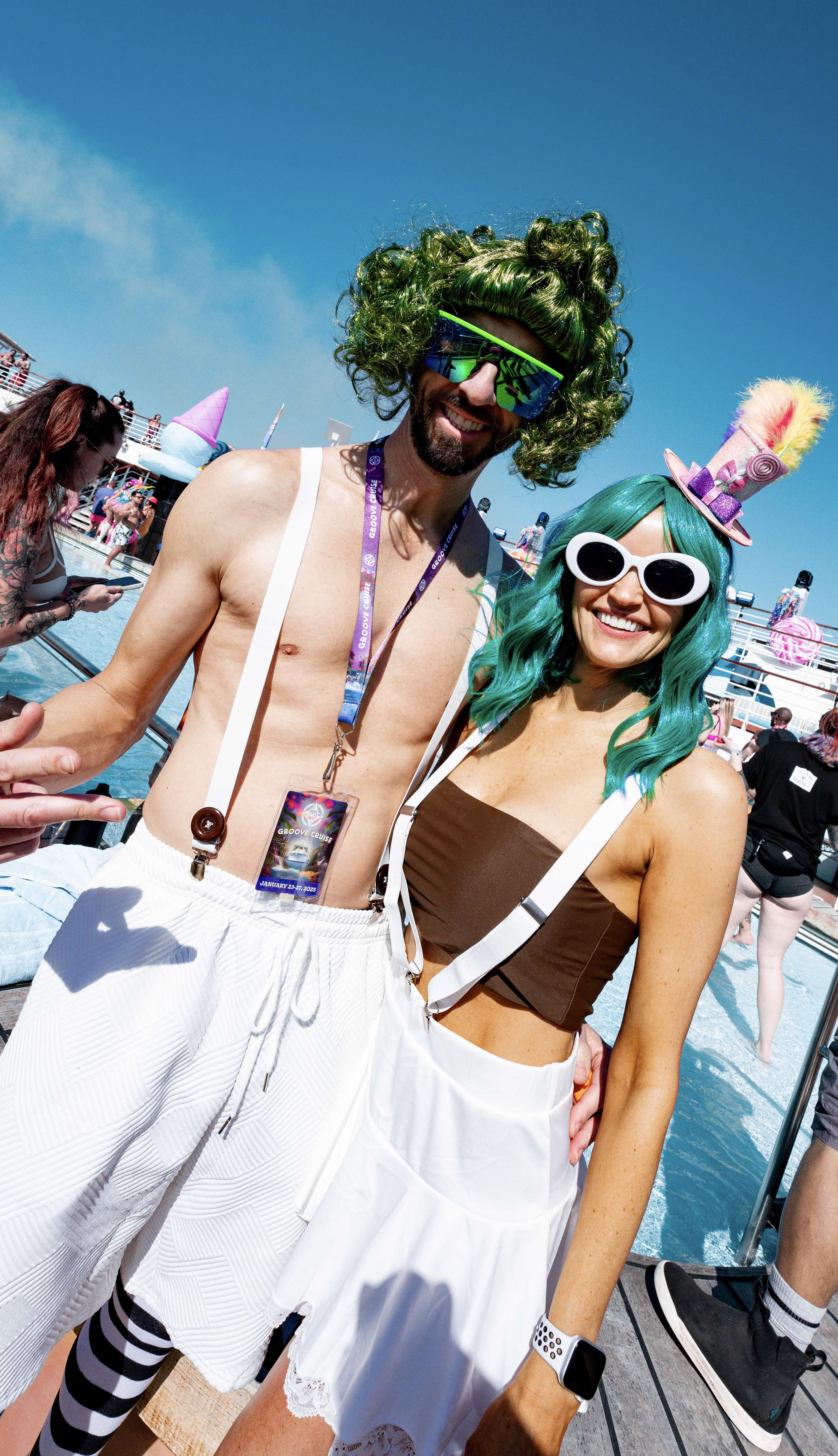 Festival couple in candy-themed rave costumes for 50 Shades of Candyland
