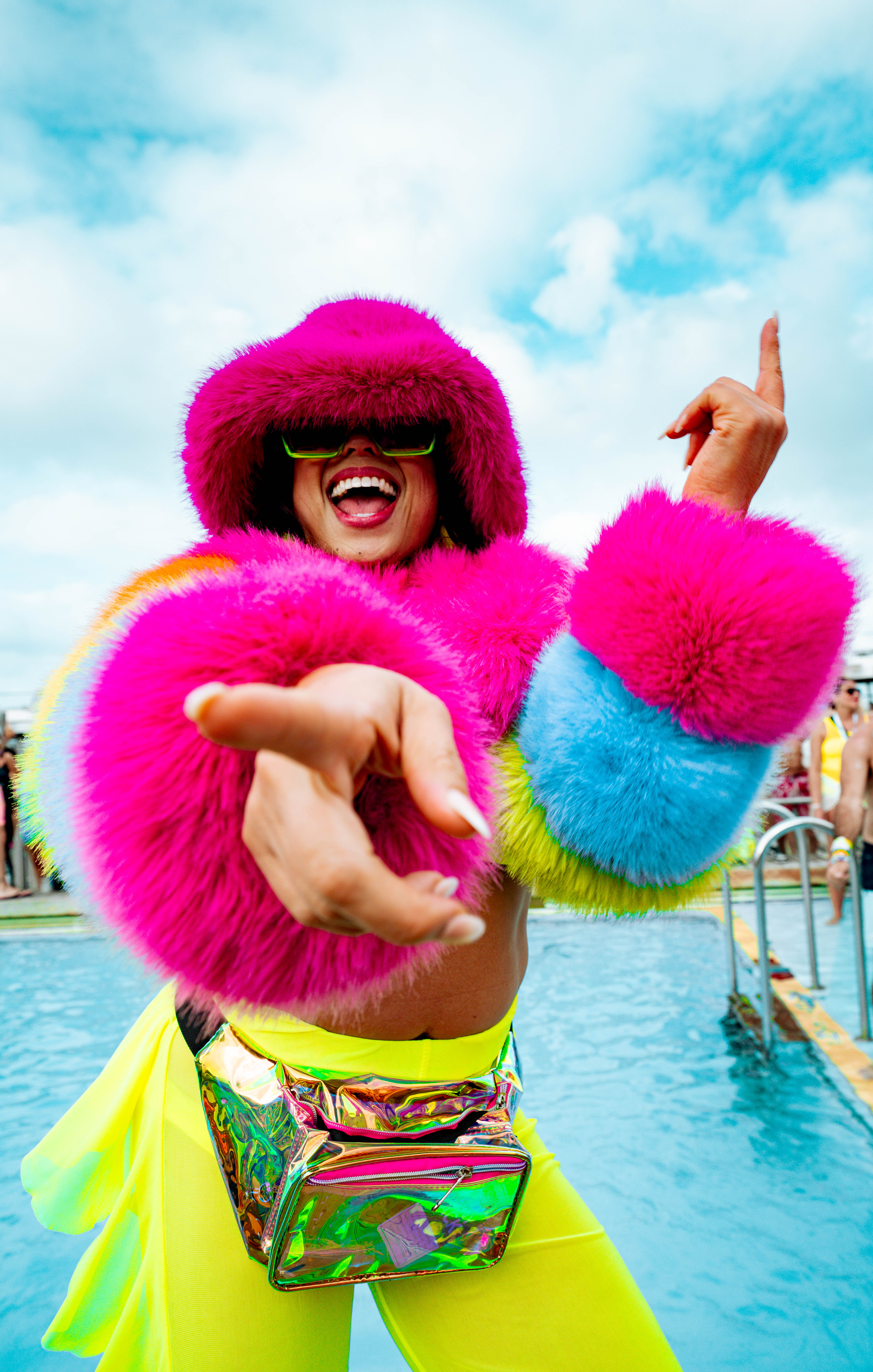 EDM cruise guest in neon costume dancing on deck during Neon Splash theme day