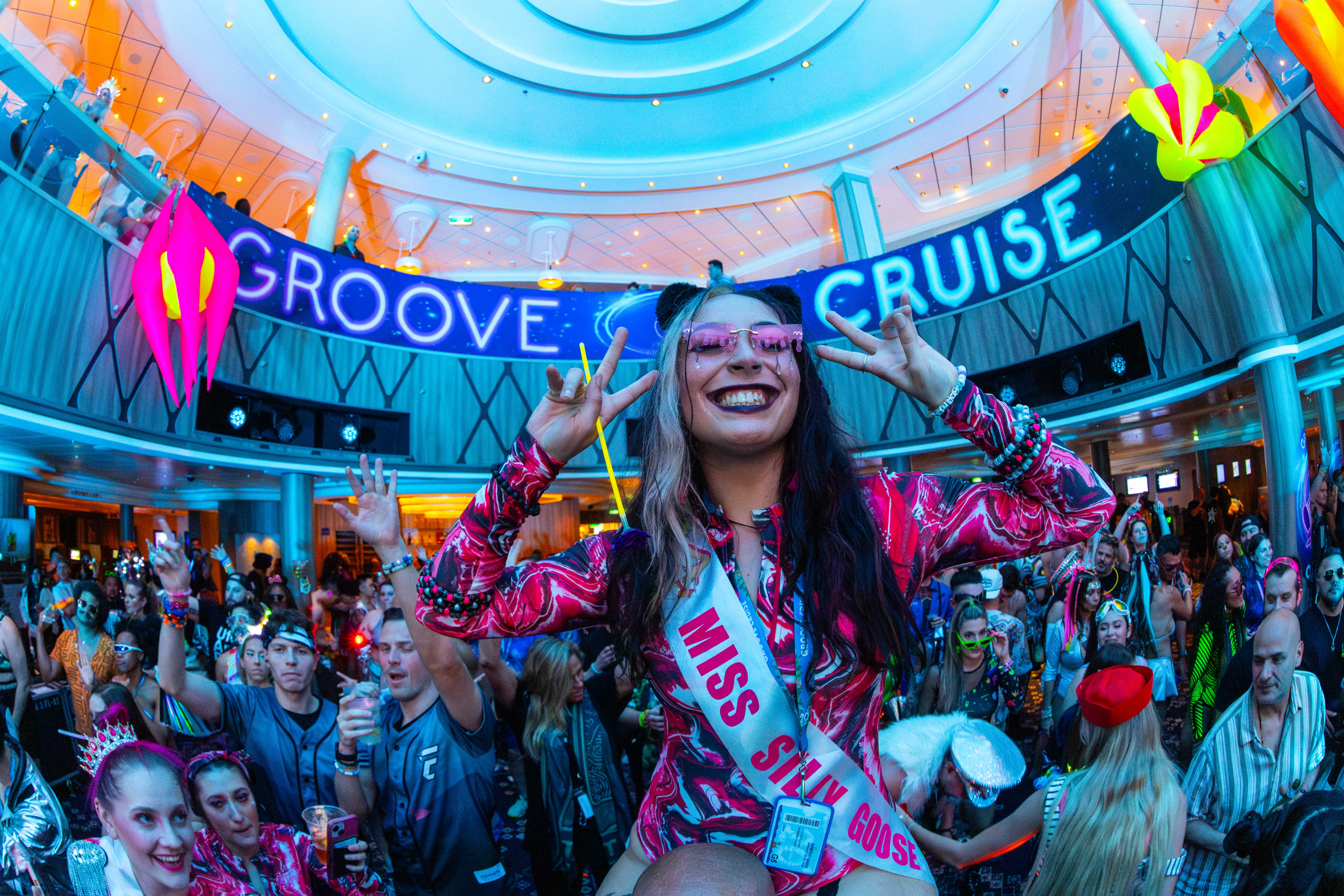 Music festival cruise attendee dressed in rave outfit for Groove Cruise