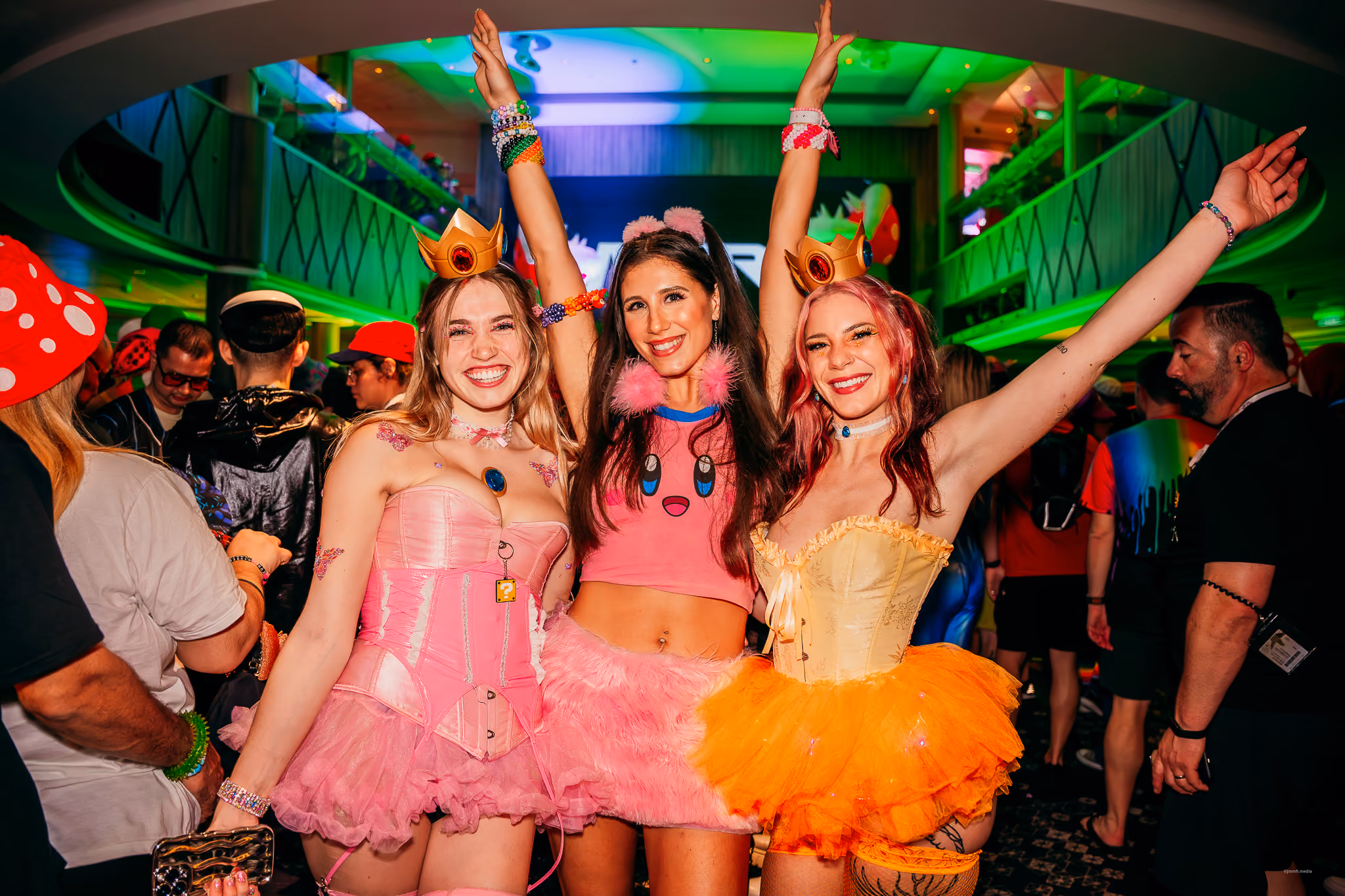 Festival cruise attendees dressed in theme party outfits on Groove Cruise