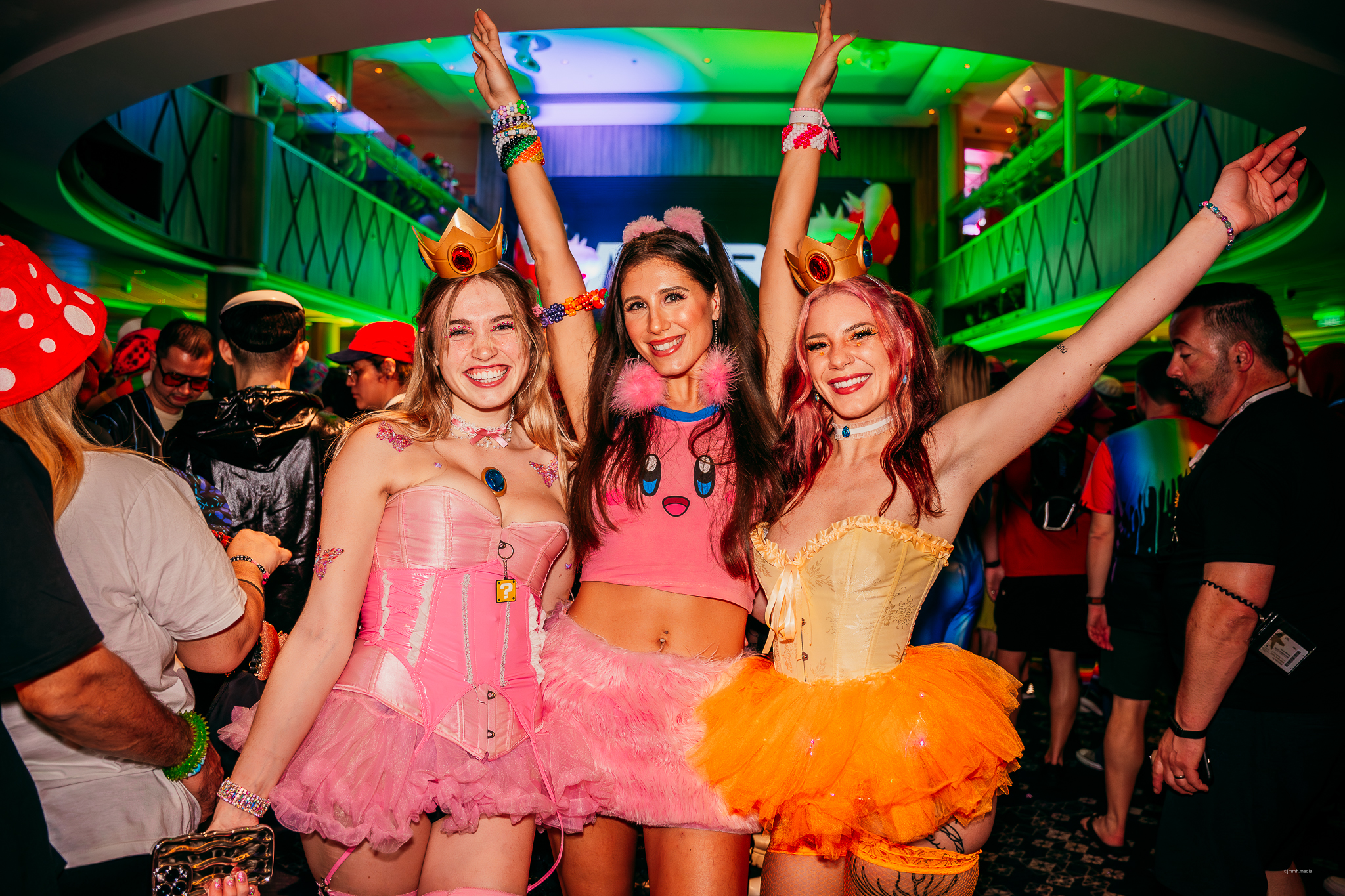 Festival cruise attendees dressed in theme party outfits on Groove Cruise