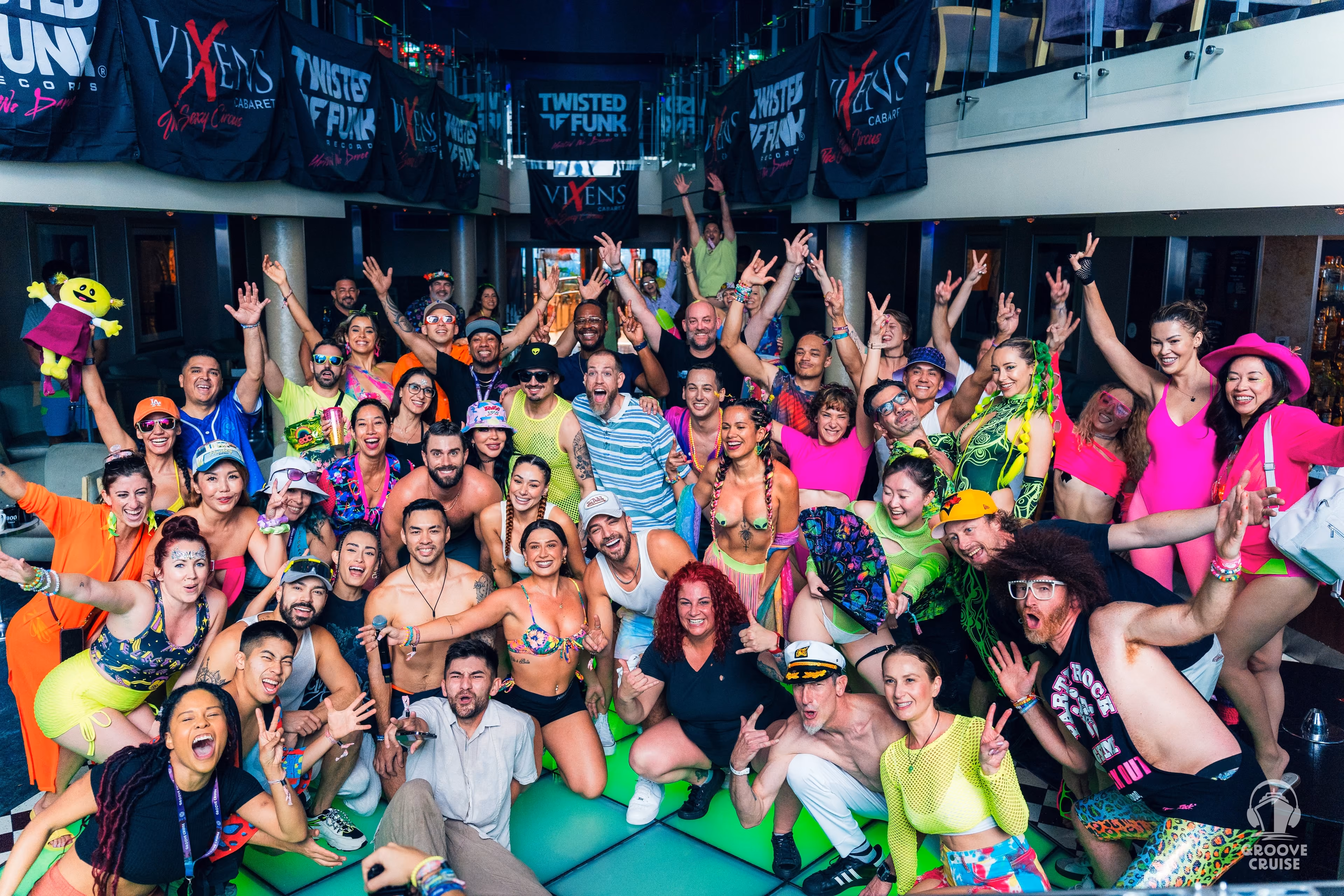 Group of Groove Cruise fans dressed in neon themed rave outfits