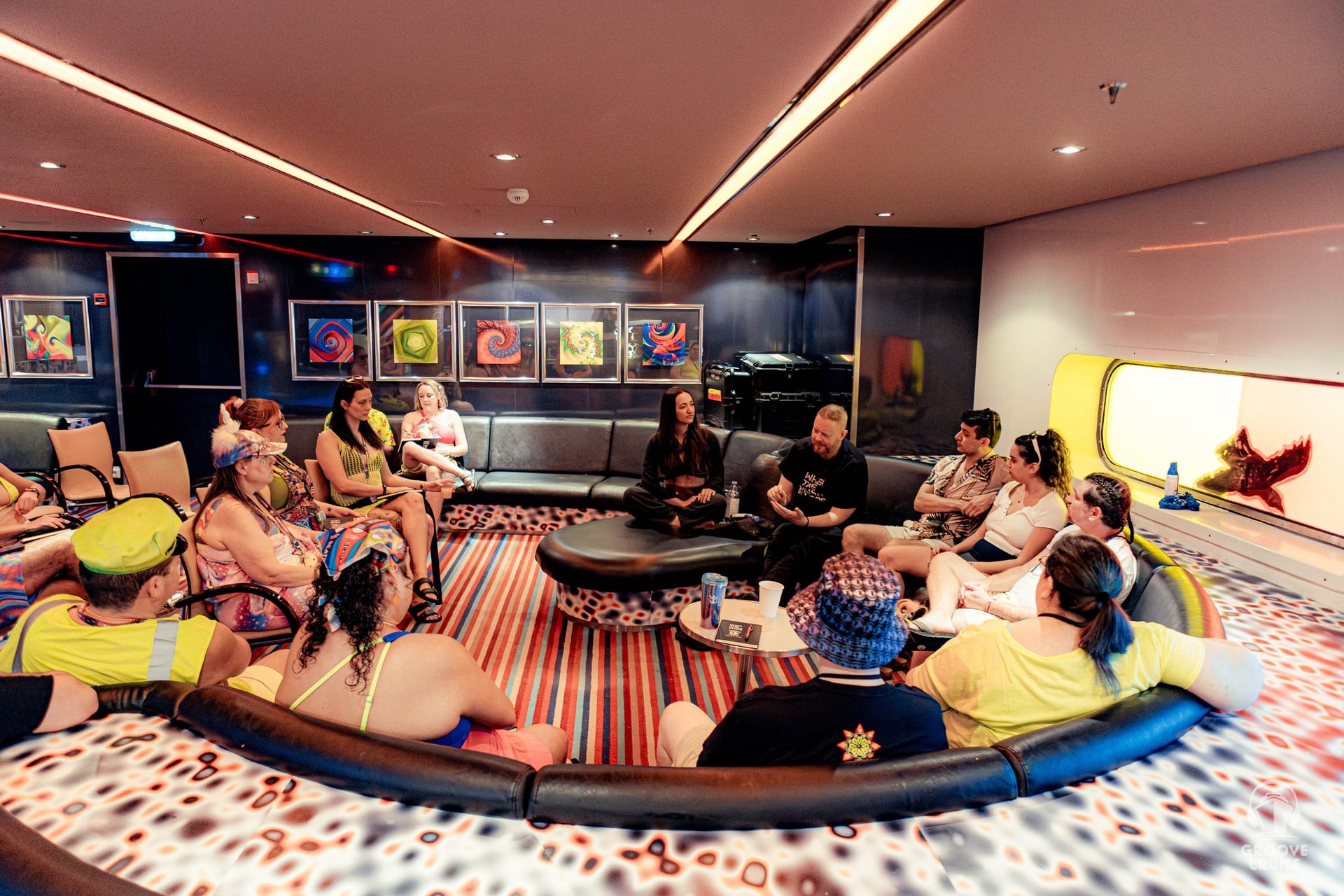 Festival-goers chatting during mental health panel on Groove Cruise