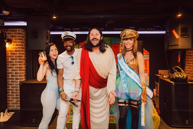 Groove Cruise resident trance DJ Trance Jesus posing with fans during artist hosted activity