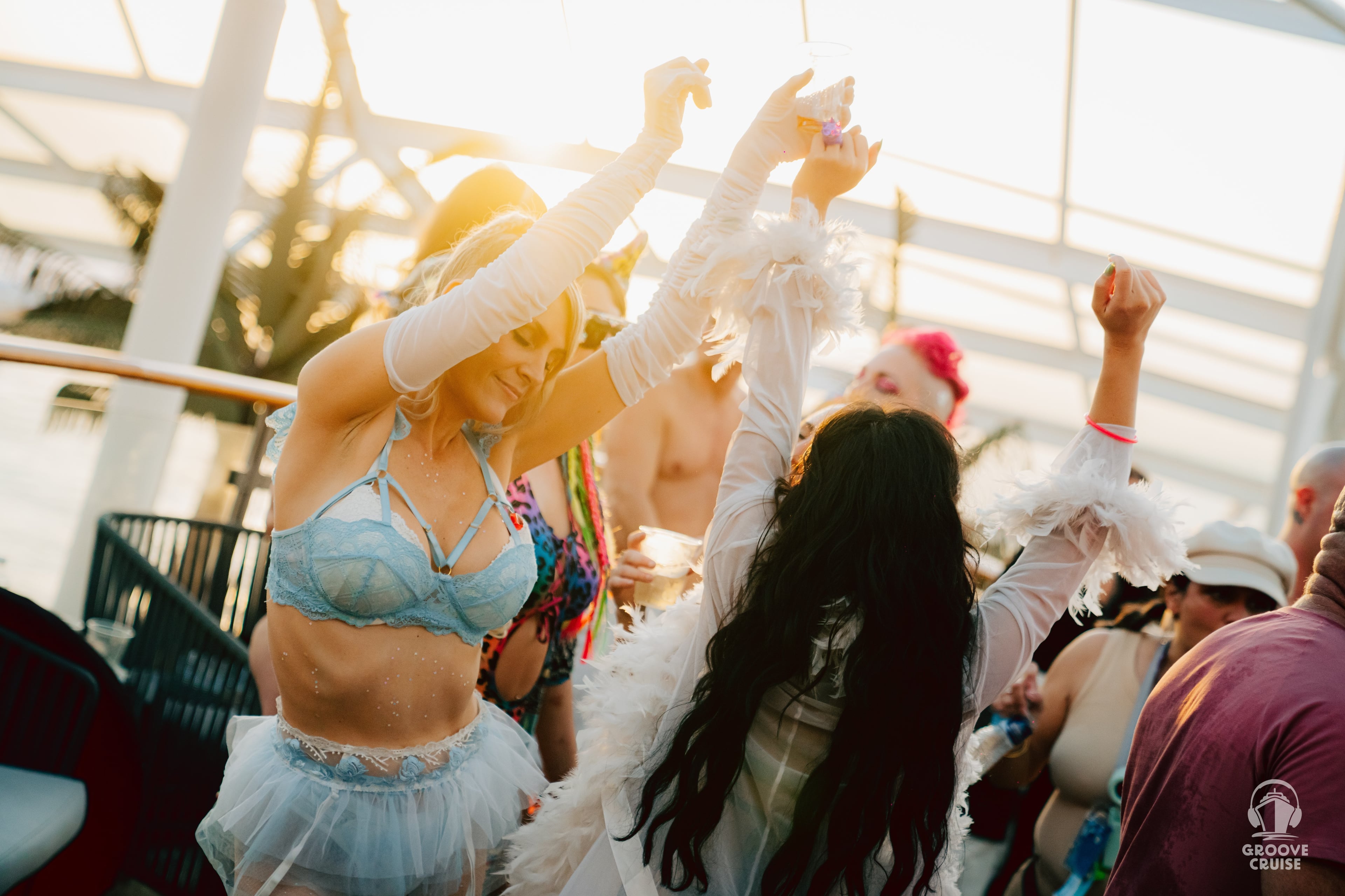 Festival cruise attendee dancing to house music on ship deck