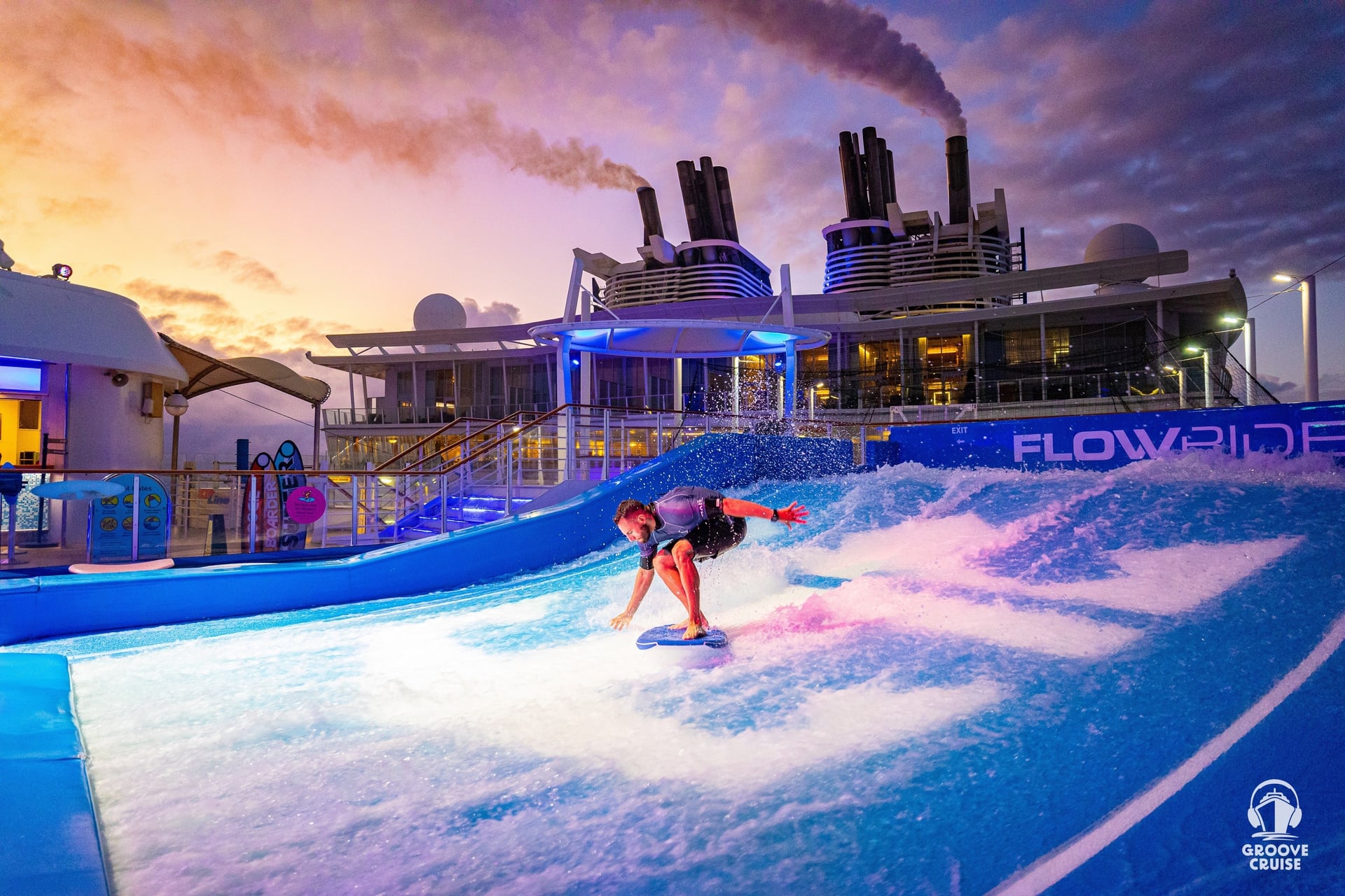 Captain enjoying FlowRider surf simulator on Wonder of the Seas pool deck at sunset