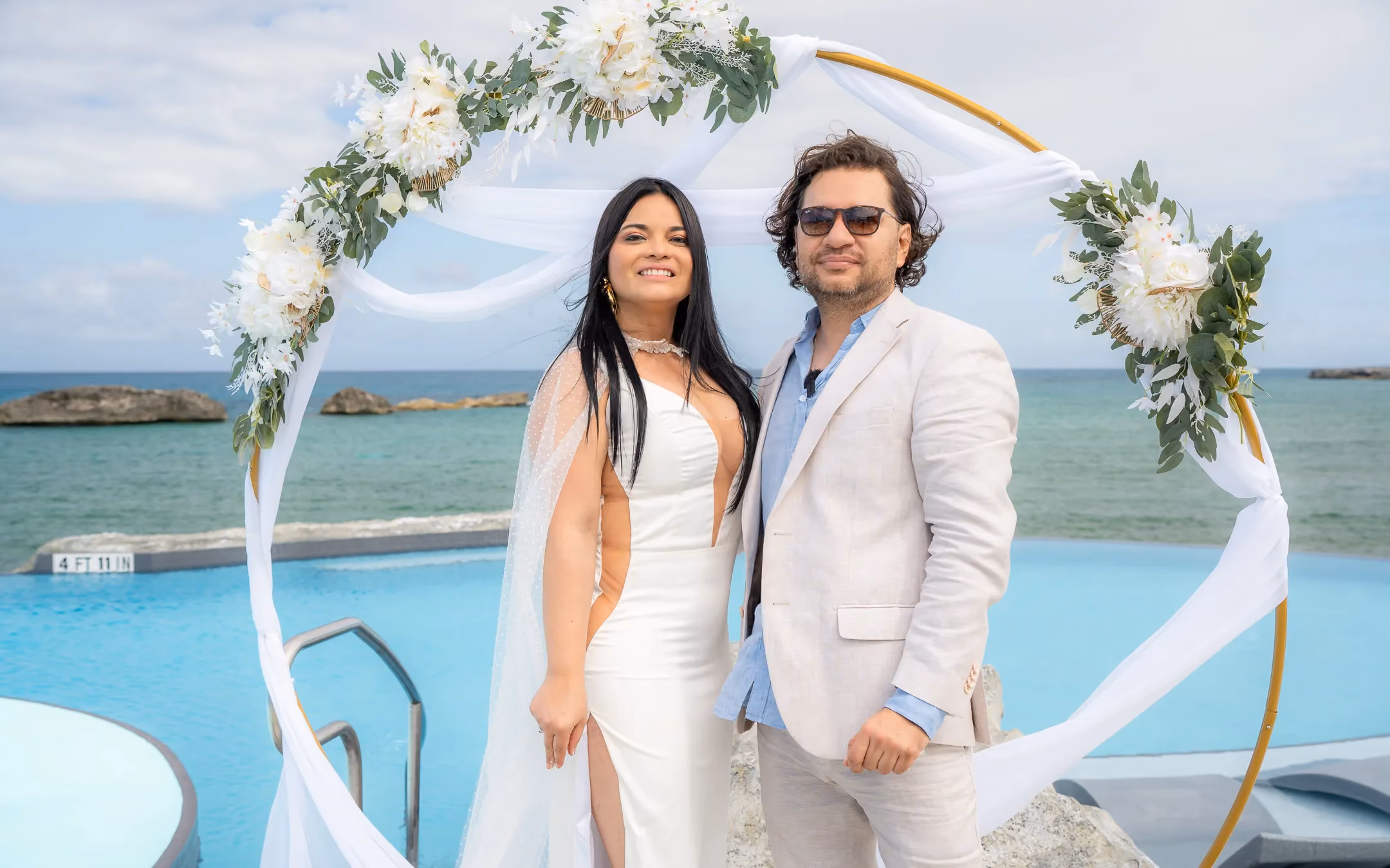 Bride and groom at cruise destination wedding with ocean views