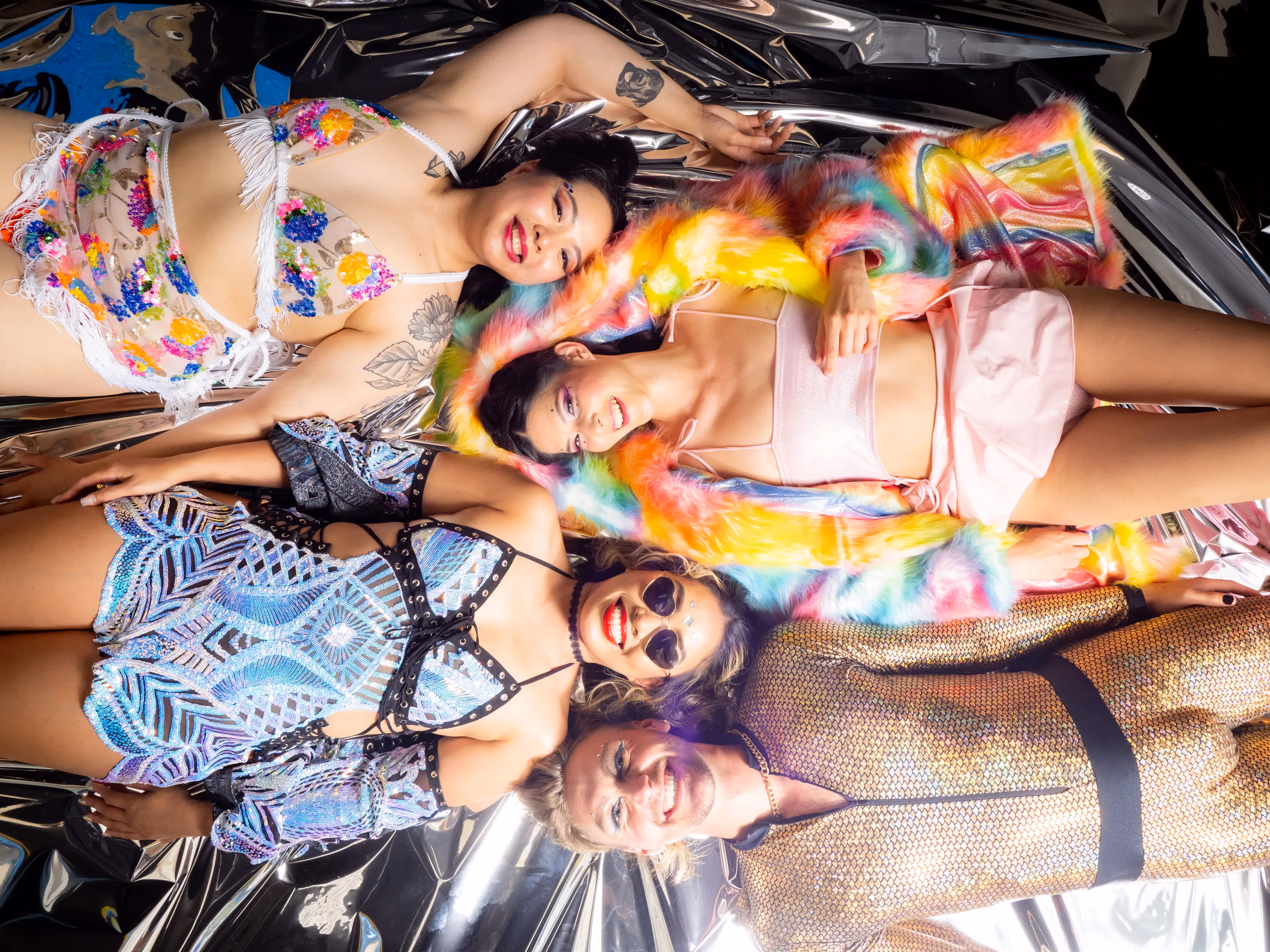 Raveival team showing off sustainable festival runway looks.